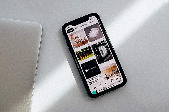 black iphone 5 on white table