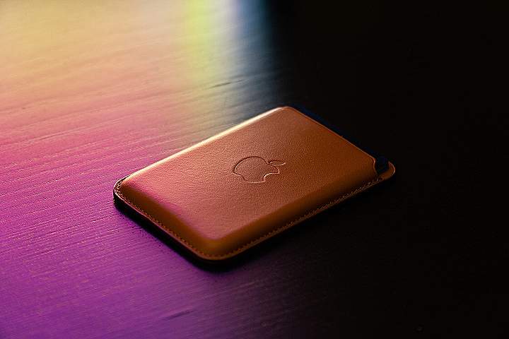 gold apple tv on brown wooden table