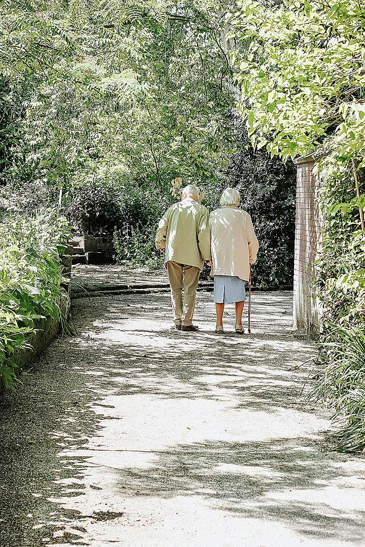 man and woman walking on road during daytime
