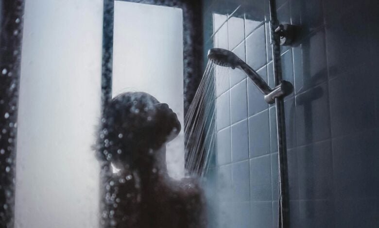 woman under showerhead